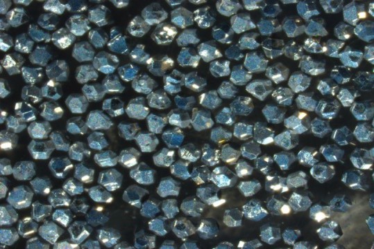 Diamonds with carbon coating
